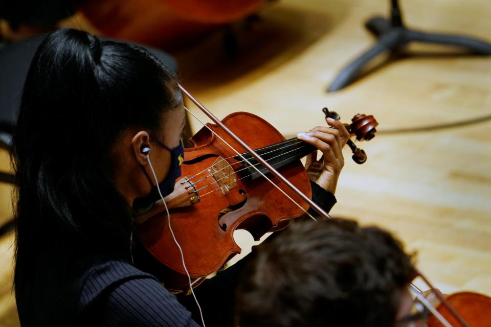 A member of the Detroit Symphony Orchestra contributes to the score for the documentary "Gradually, Then Suddenly: The Bankruptcy of Detroit" on Dec. 6, 2021.