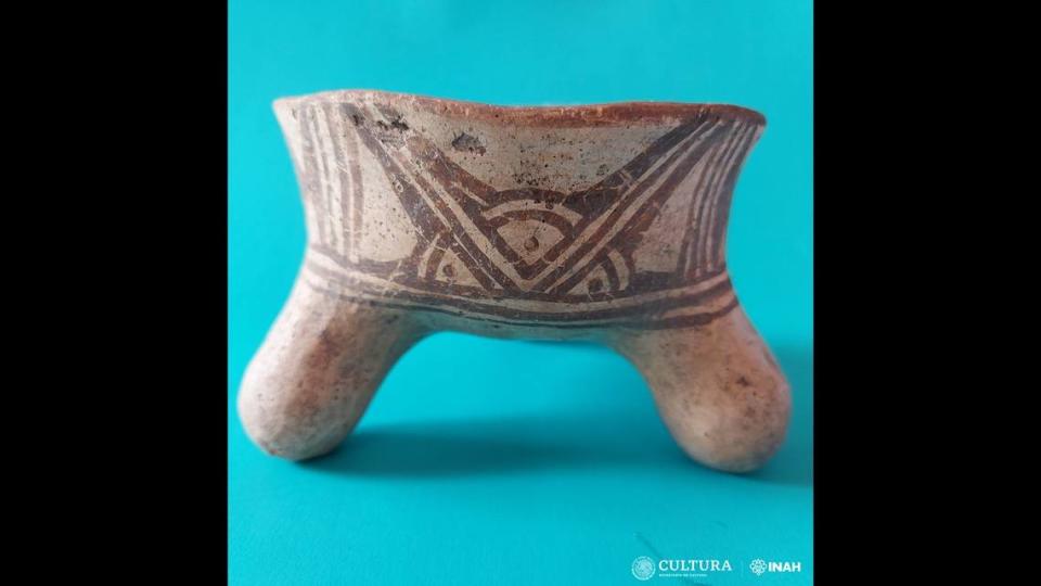 A unique tripod bowl was buried with the child, experts said.