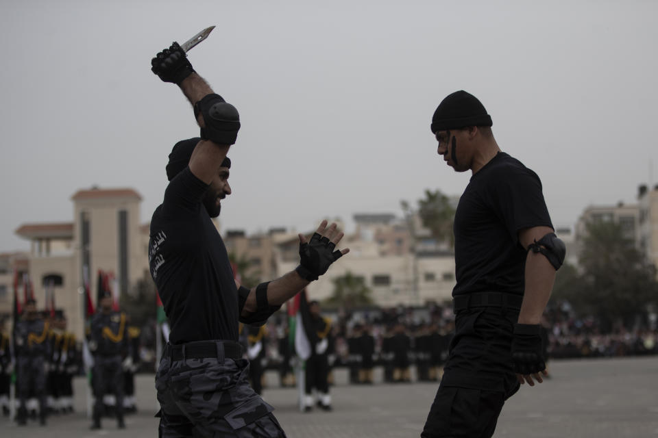 Members of the Palestinian security forces loyal to Hamas display their skills during a graduation ceremony in Gaza City, Gaza’s Hamas rulers collect millions of dollars a month in taxes and customs at a crossing on the Egyptian border – providing a valuable source of income that helps it sustain a government and powerful armed wing. After surviving four wars and a nearly 15-year blockade, Hamas has become more resilient and Israel has been forced to accept that its sworn enemy is here to stay. Sunday, Dec. 12, 2021. (AP Photo/ Khalil Hamra)