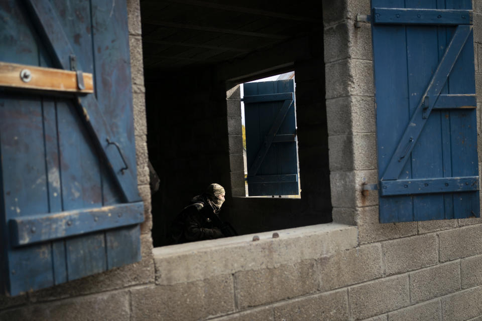 Ukrainian infantrymen train with French soldiers to learn combat skills, in France, Tuesday, Nov. 7, 2023. With the full-scale war grinding into a second winter, and casualties already counted in the hundreds of thousands continuing to mount on both sides, the training has become crucially important for Ukraine's chances of victory. (AP Photo/Laurent Cipriani)