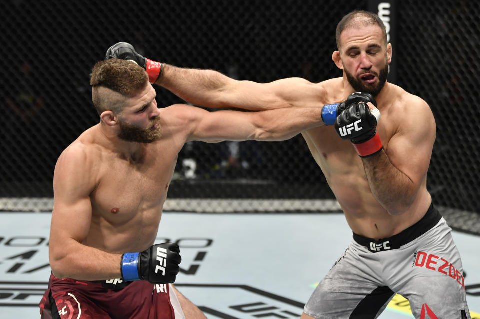 ABU DHABI, UNITED ARAB EMIRATES - JULY 12: (L-R) Jiri Prochazka of the Czech Republic punches Volkan Oezdemir of Switzerland in their light heavyweight fight during the UFC 251 event at Flash Forum on UFC Fight Island on July 12, 2020 on Yas Island, Abu Dhabi, United Arab Emirates. (Photo by Jeff Bottari/Zuffa LLC)