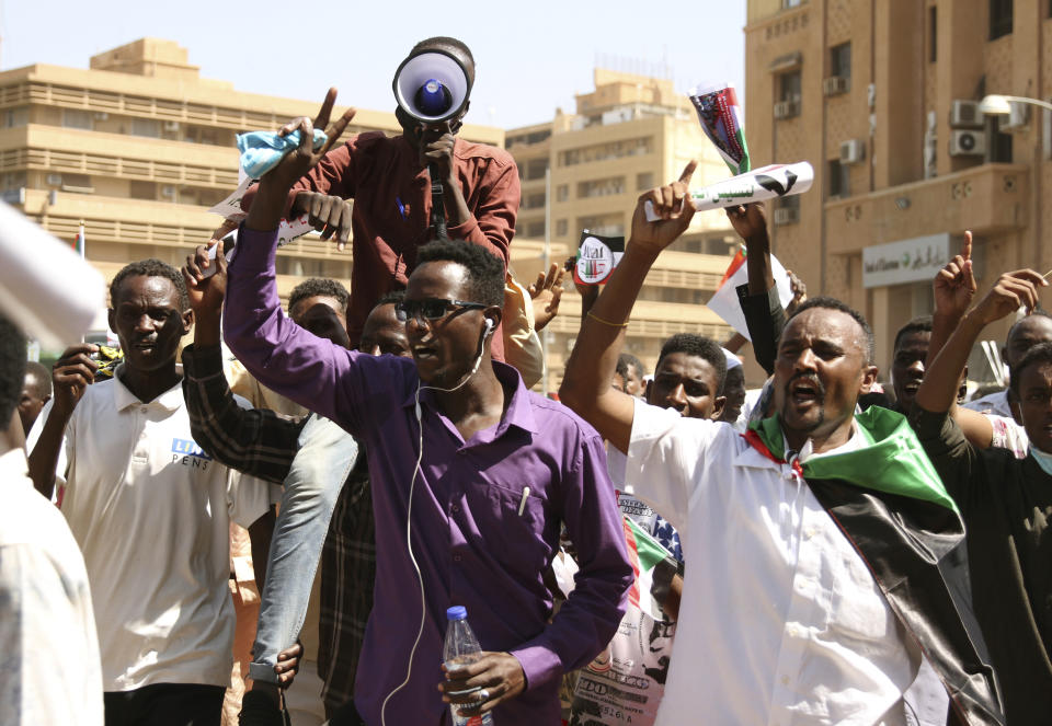 Sudanese protesters take part in a rally demanding the dissolution of the transitional government, outside the presidential palace in Khartoum, Sudan, Saturday, Oct. 16, 2021. (AP Photo/Marwan Ali)