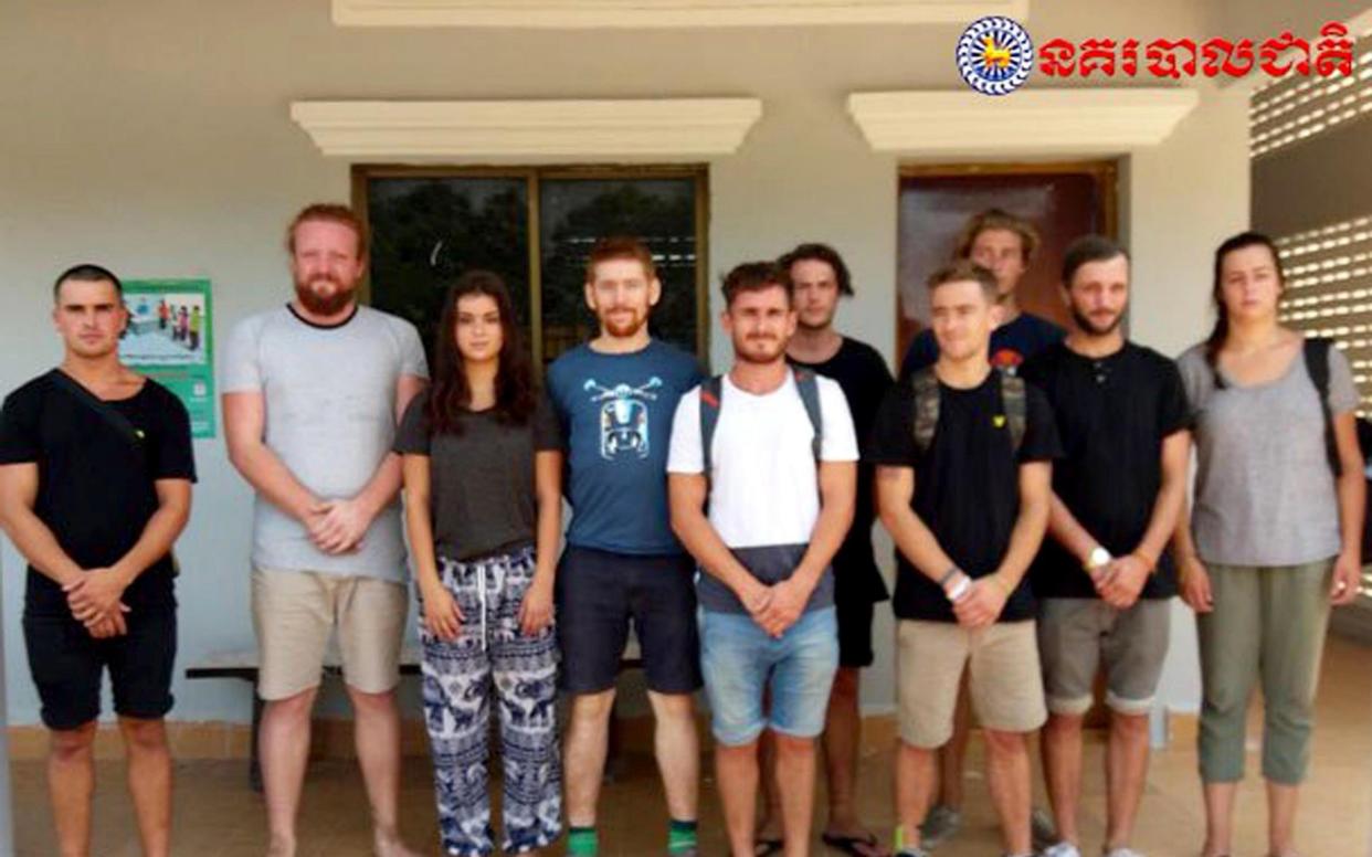 A photograph released by the Cambodian police show the ten foreign tourists who have been detained - PA