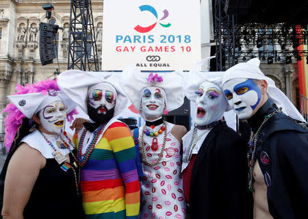 People pose as they attend the inauguration of the Gay Games village at the Hotel de Ville city hall in Paris, France, August 4, 2018. REUTERS/Regis Duvignau
