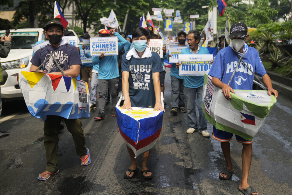 FILE - Filipino fishermen and activists wear boat costumes to protest against alleged Chinese aggression at the disputed South China Sea as they stage a rally in front of the Chinese consulate ahead of Independence Day in Makati, Philippines, on June 11, 2024. China has been at odds with many other countries in the Asia-Pacific for years over its sweeping maritime claims, including almost all of the South China Sea, a strategic and resource-rich waterway around which Beijing has drawn a 10-dash-line on official maps to delineate what it says it its territory. (AP Photo/Aaron Favila, File)