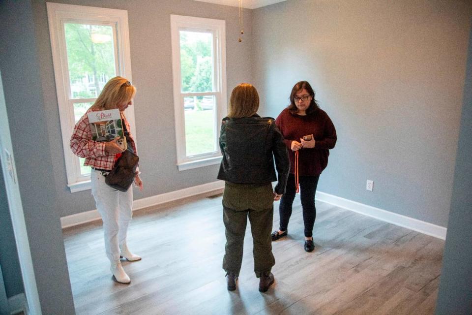 First-time home buyers Carolina Acuipil, right, and Carolina Rancano, center, tour a home for sale with Real Estate Broker Colleen Blondell in Cary on Thursday, April 27, 2023. Travis Long/tlong@newsobserver.com