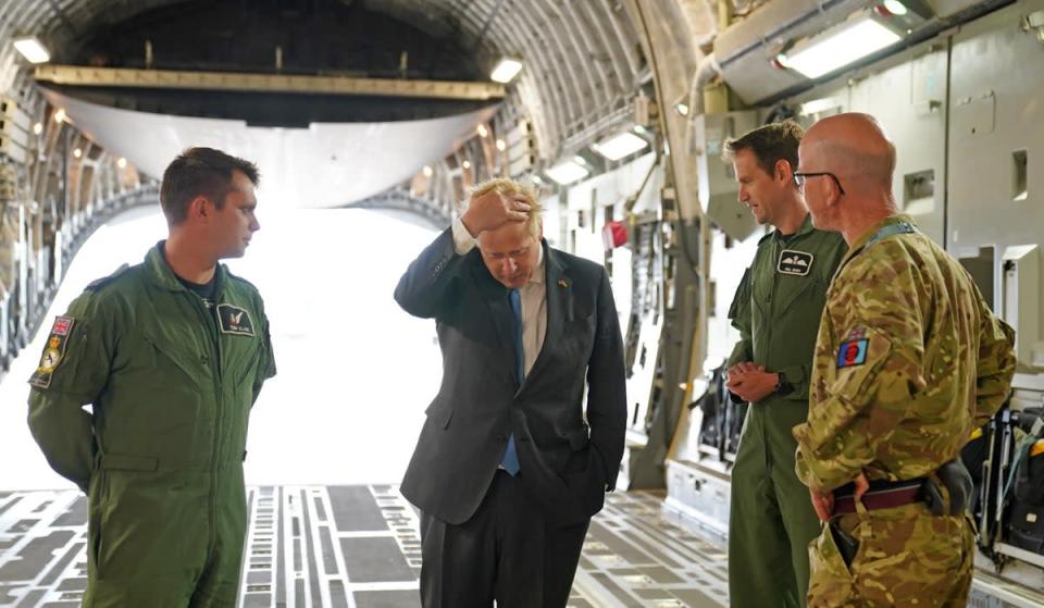Boris Johnson with aircrew on board a C17, after arriving at RAF Brize Norton following a surprise visit to Kyiv (Joe Giddens/PA) (PA Wire)