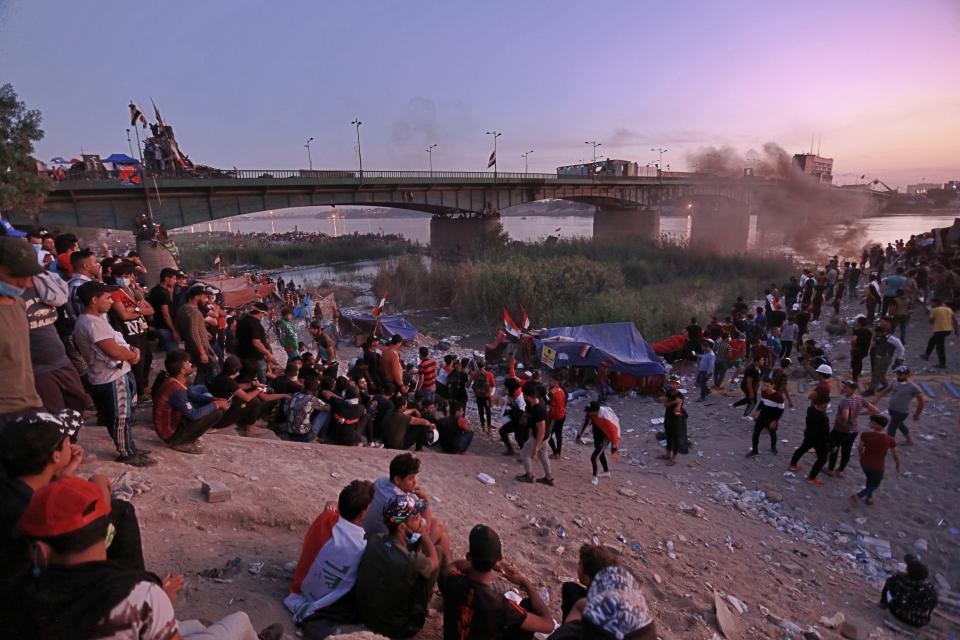 Anti-government protesters stage a sit-in around a bridge leading to the Green Zone government areas in Baghdad, Iraq, Tuesday, Nov. 5, 2019. (AP Photo/Hadi Mizban)