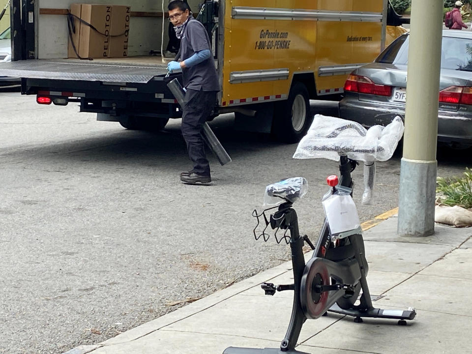 A Peloton indoor exercise bicycle is delivered to a customer during the coronavirus disease (COVID-19) lockdown in San Francisco, California, U.S. April 9, 2020. REUTERS/Greg Mitchell