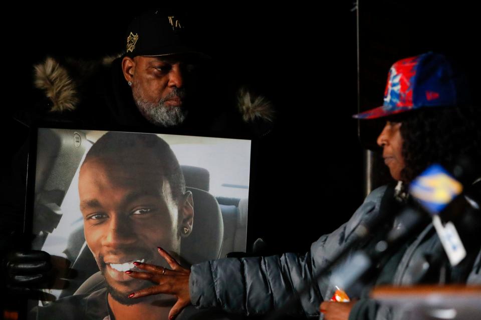Rodney Wells, the father of Tyre Nichols, holds a picture of Nichols as RowVaughn Wells, Nichols’ mother, touches his face during a candlelight vigil for Nichols held at the site where he was beaten to death by Memphis Police Department officers on the one year anniversary of his death in Memphis, Tenn., on Jan. 7.