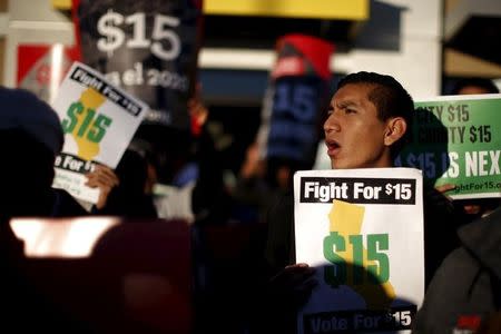 Fast-food workers and their supporters join a nationwide protest for higher wages and union rights outside McDonald's in Los Angeles, California, United States, November 10, 2015. REUTERS/Lucy Nicholson