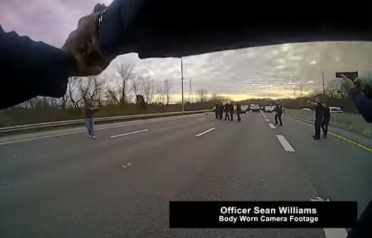 A still from body camera video released by Nashville police show officers surrounding a man later identified as Landon Eastep on I-65 on January 27, 2022. / Credit: Metro Nashville Police Department