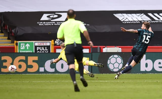 Stuart Dallas, right, shoots towards goal but sees his shot cleared off the line by Chris Basham, not pictured