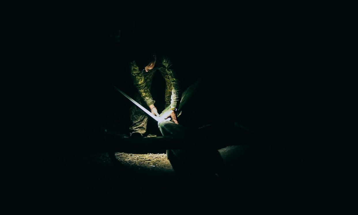 <span>An operator sets a reconnaissance drone before its flight.</span><span>Photograph: Julia Kochetova/The Guardian</span>