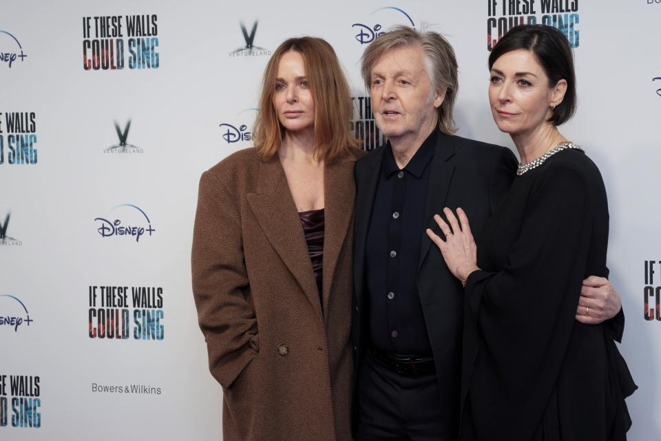 Stella McCartney (from left), Paul McCartney and Mary McCartney pose for photographers at the Dec. 12 London premiere of "If These Walls Could Sing." Mary McCartney's documentary about Abbey Road Studios focuses on the history of a place where her famous father made some of his greatest music.