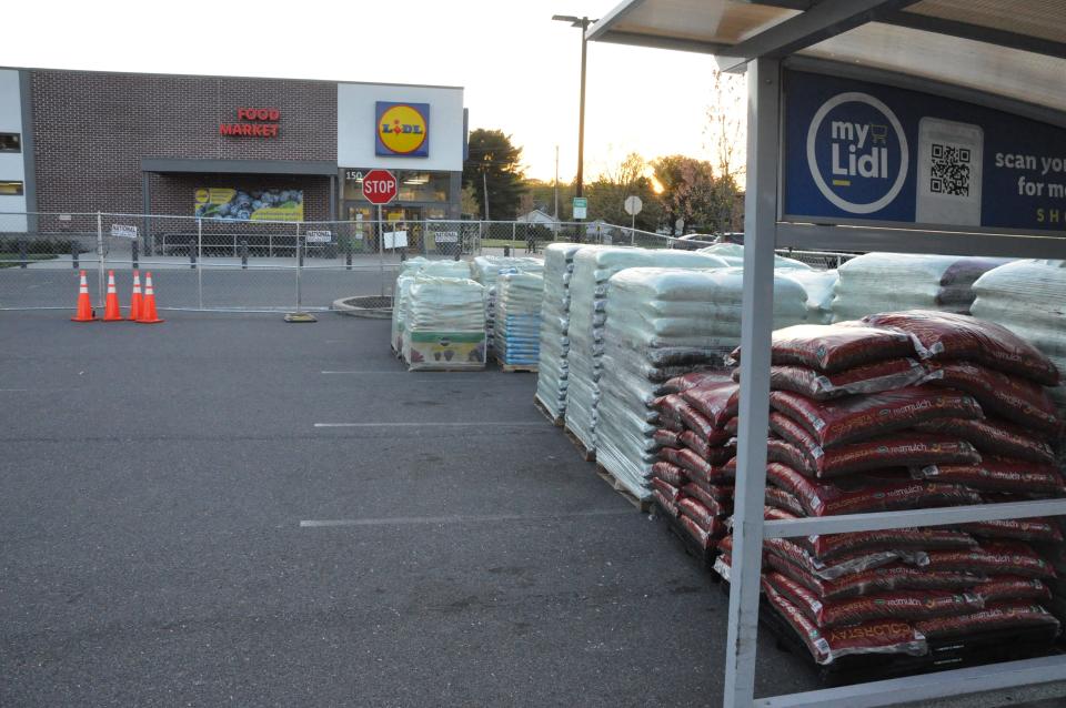 Stacks of gardening supplies sit in the parking lot of the Lidl location in Dover on April 22, 2024. Lidl locations in Delaware opened pop-up garden centers featuring plants and gardening supplies on April 24.