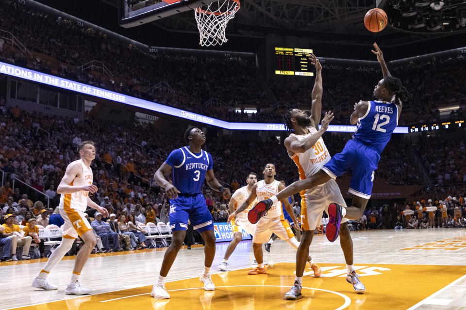 Kentucky guard Antonio Reeves (12) shoots over Tennessee guard Josiah-Jordan James (30) during the second half of an NCAA college basketball game Saturday, March 9, 2024, in Knoxville, Tenn. (AP Photo/Wade Payne)