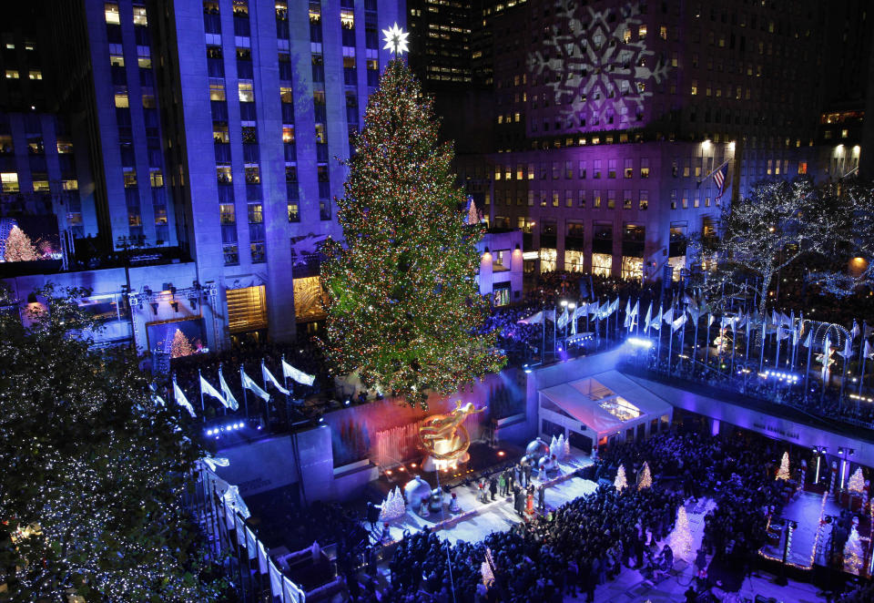 The Rockefeller Center Christmas Tree is lit during the 80th annual tree lighting ceremony at Rockefeller Center in New York, Wednesday, Nov. 28, 2012. (AP Photo/Kathy Willens)