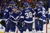 Tampa Bay Lightning center Steven Stamkos (91) celebrates his goal against the Columbus Blue Jackets with defenseman Nick Perbix (48), left wing Brandon Hagel (38), and defenseman Erik Cernak (81) during the third period of an NHL hockey game Tuesday, April 9, 2024, in Tampa, Fla. (AP Photo/Chris O'Meara)