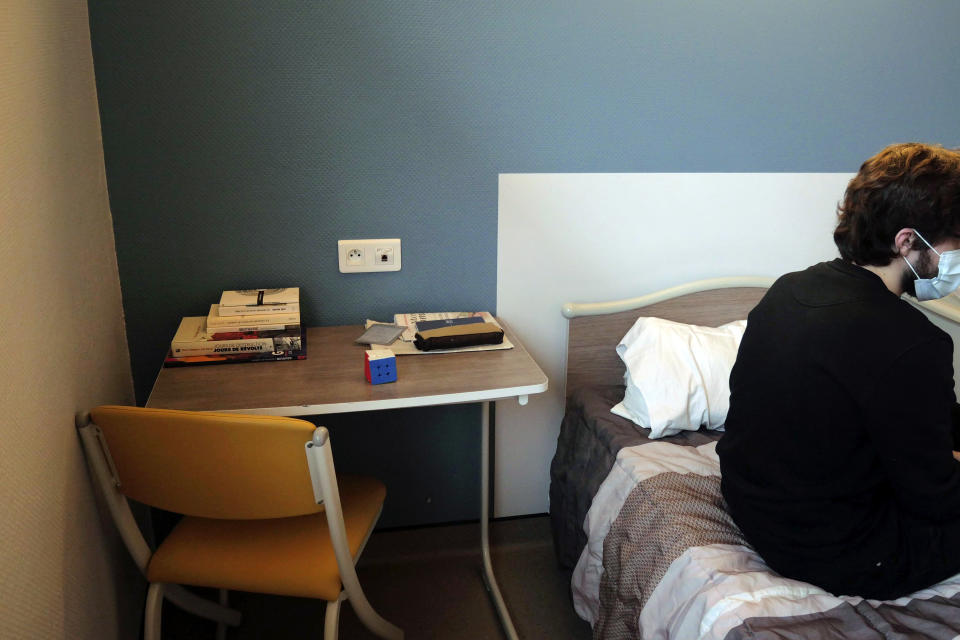 Books and a Rubik's cube are placed in the bedside table of Nathan, a 22-year-old student, in the Rouvray psychiatric hospital, in Rouen, western France, Wednesday, Nov. 25, 2020. Lockdowns that France has used to fight the coronavirus have come at considerable cost to mental health. Surveying points to a surge of depression most acute among people without work, in financial hardship and young adults. (AP Photo/Thibault Camus)