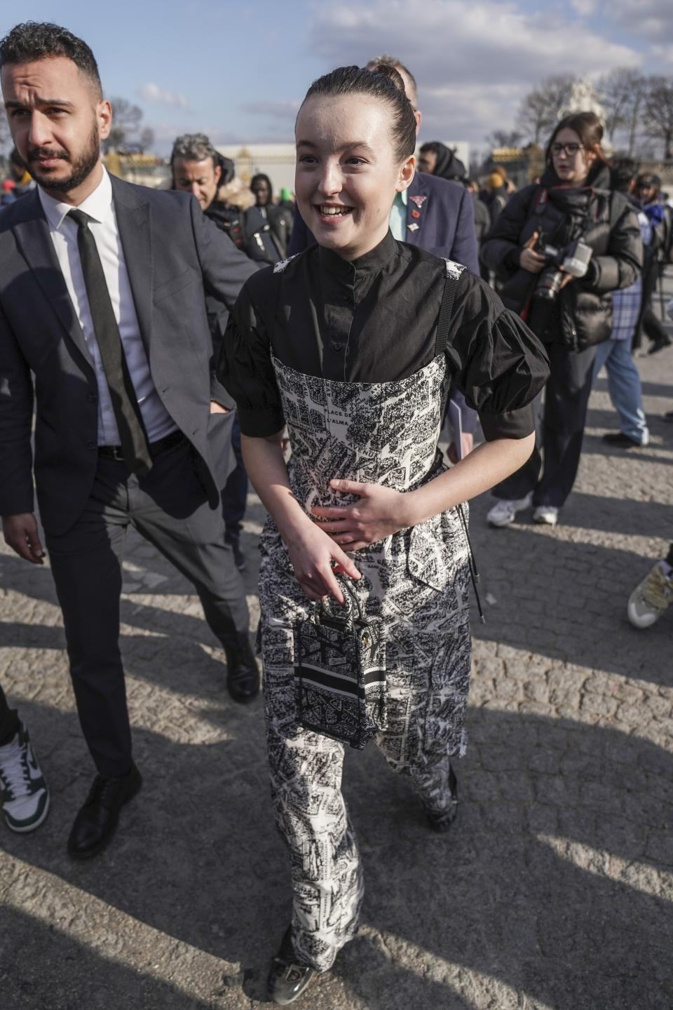 Bella Ramsey poses for photographers upon arrival at the Christian Dior Fall/Winter 2023-2024 ready-to-wear collection presented Tuesday, Feb. 28, 2023 in Paris. (Scott Garfitt/Invision/AP)