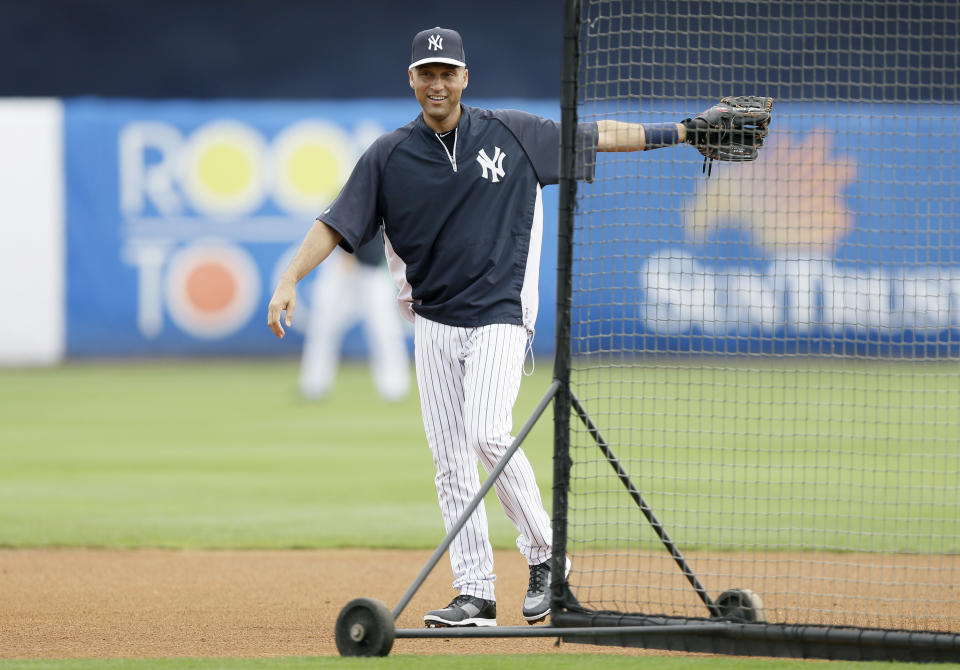 New York Yankees shortstop Derek Jeter looks on during batting practice before an exhibition baseball game against the Pittsburgh Pirates Thursday, Feb. 27, 2014, in Tampa, Fla. (AP Photo/Charlie Neibergall)