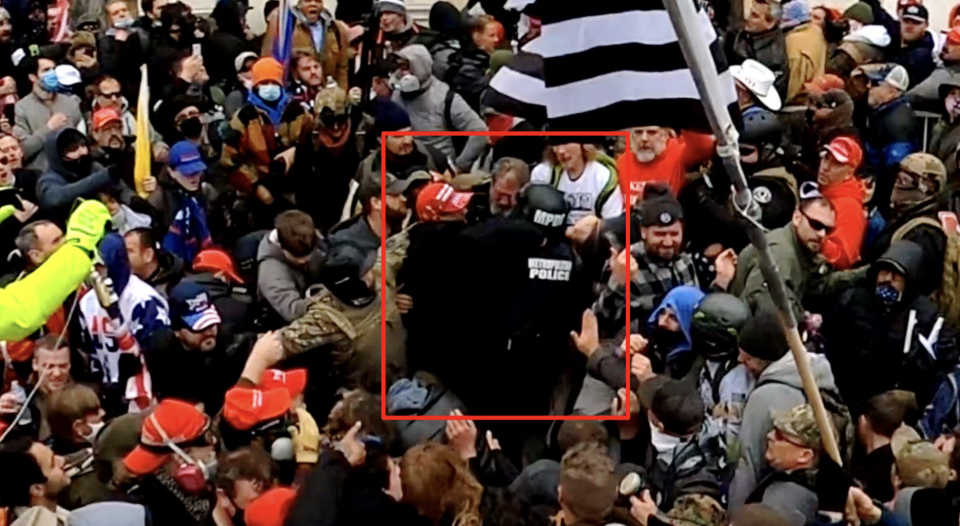 File: Daniel Rodriguez, in Trump hat, shown near police officer at Capitol on Jan. 6, 2021. / Credit: Government exhibit