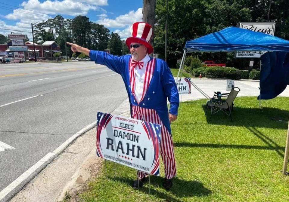 Maurice Rahn, Damon Rahn's father, helps garner support for his son during the General Primary Tuesday in Effingham County.