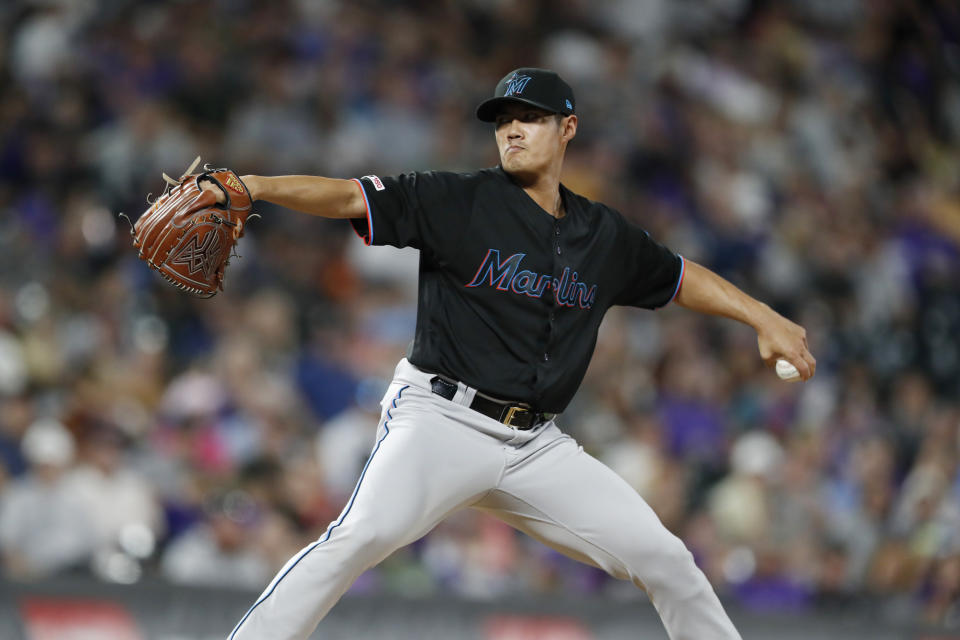 Miami Marlins relief pitcher Wei-Yin Chen works against the Colorado Rockies during the seventh inning of a baseball game Saturday, Aug. 17, 2019, in Denver. (AP Photo/David Zalubowski)