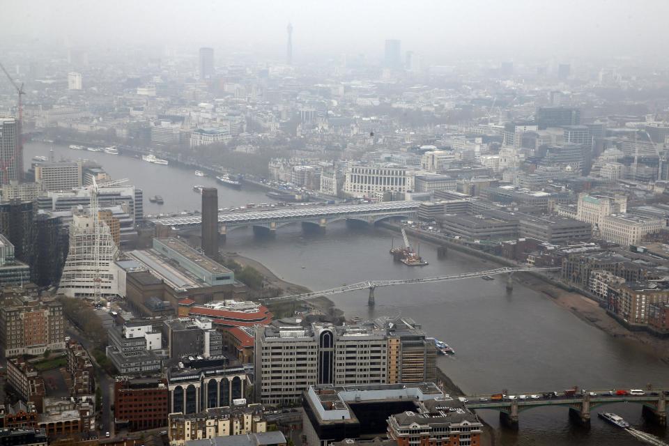 A view of London's skyline, Thursday, April 3, 2014. British authorities have warned people with heart or lung conditions to avoid exertion as a combination of industrial pollution and Sahara dust blankets the country in smog. The environment department said air pollution level could reach the top rung on its 10-point scale. The pollution is expected to ease by Friday. (AP Photo/Lefteris Pitarakis)