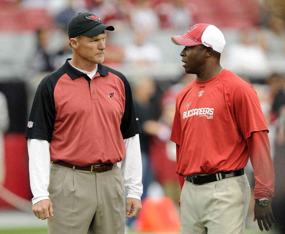 GLENDALE, AZ - OCTOBER 31:  Head Coach of the Tampa Bay Buccaneers Raheem Morris and Head Coach of the Arizona Cardinals Ken Whisenhunt talk before the game at University of Phoenix Stadium on October 31, 2010 in Glendale, Arizona.  (Photo by Harry How/Getty Images)