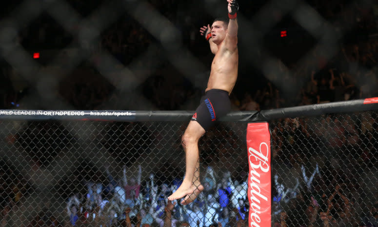 Chris Weidman celebrates a UFC victory in the octagon.