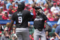 Miami Marlins' Jazz Chisholm Jr., right, is congratulated by teammate Josh Bell (9) after hitting a three-run home run during the first inning of a baseball game against the St. Louis Cardinals Sunday, April 7, 2024, in St. Louis. (AP Photo/Jeff Roberson)