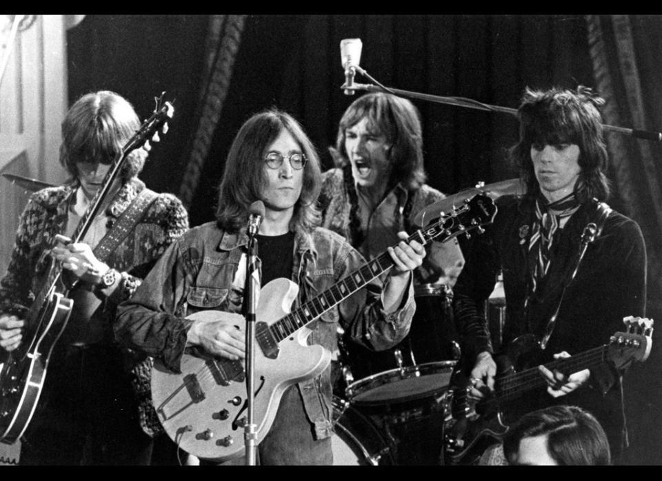 At Rock and Roll Circus in 1968. Keith Richards (on bass) joins John Lennon, Eric Clapton, and Mitch Mitchell from the Jimi Hendrix Experience on drums.