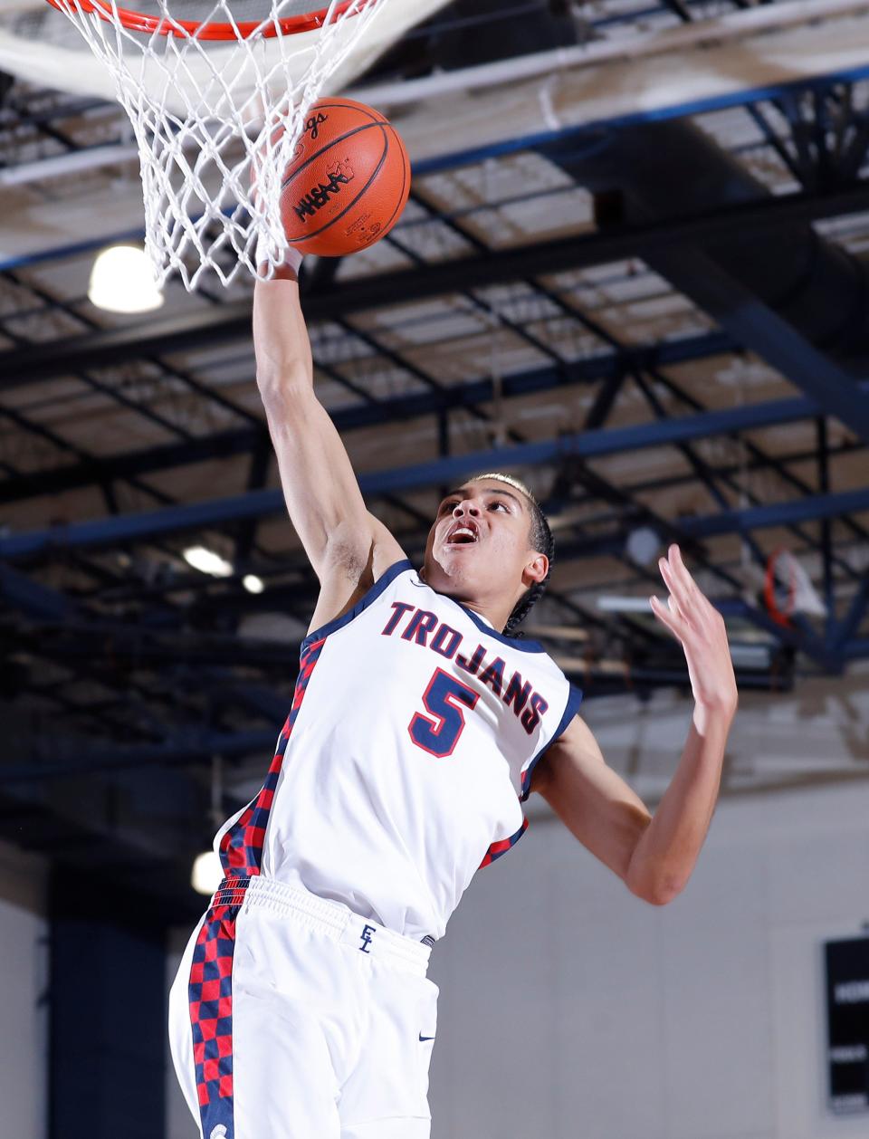 East Lansing's Cam Hutson goes up for a dunk against Waverly, Thursday, Jan. 11, 2024, in East Lansing.