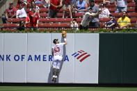 St. Louis Cardinals center fielder Michael Siani (63) jumps at the wall but is unable to catch a home run by Boston Red Sox's Rafael Devers in the sixth inning of a baseball game, Sunday, May 19, 2024, in St. Louis. (AP Photo/Joe Puetz)