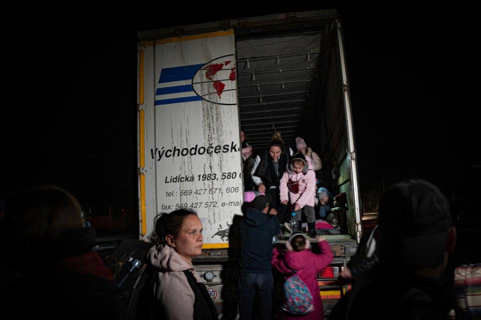 Civilians flee frontline areas in the back of articulated trucks, embarking on 11-hour journeys (Bel Trew)