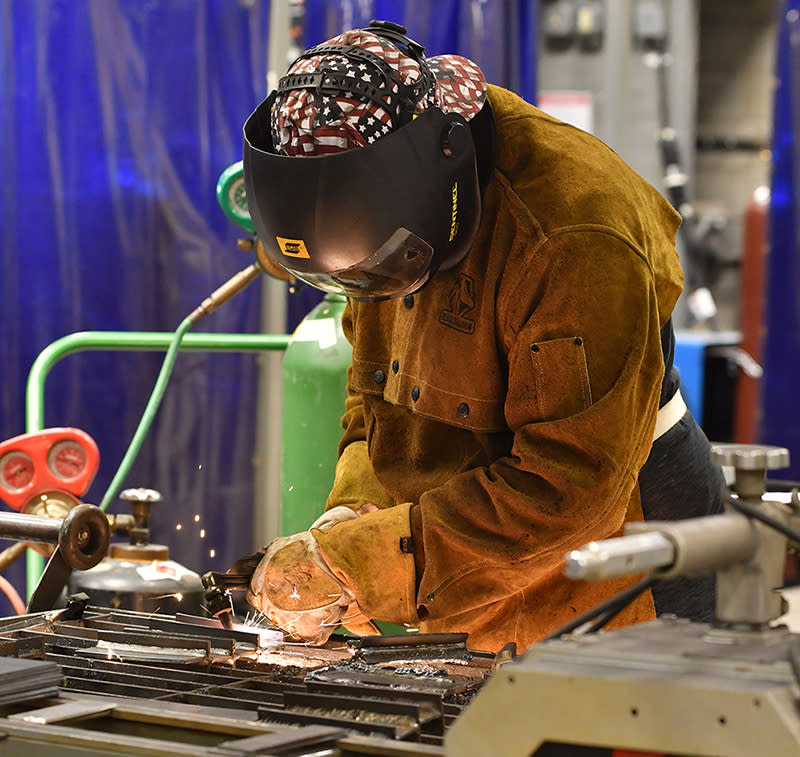 Donavan Happe, who earned a certificate in welding while attending high school, at the Welding Lab at Marshalltown Community College. (Michele Frost/Marshalltown Community College)