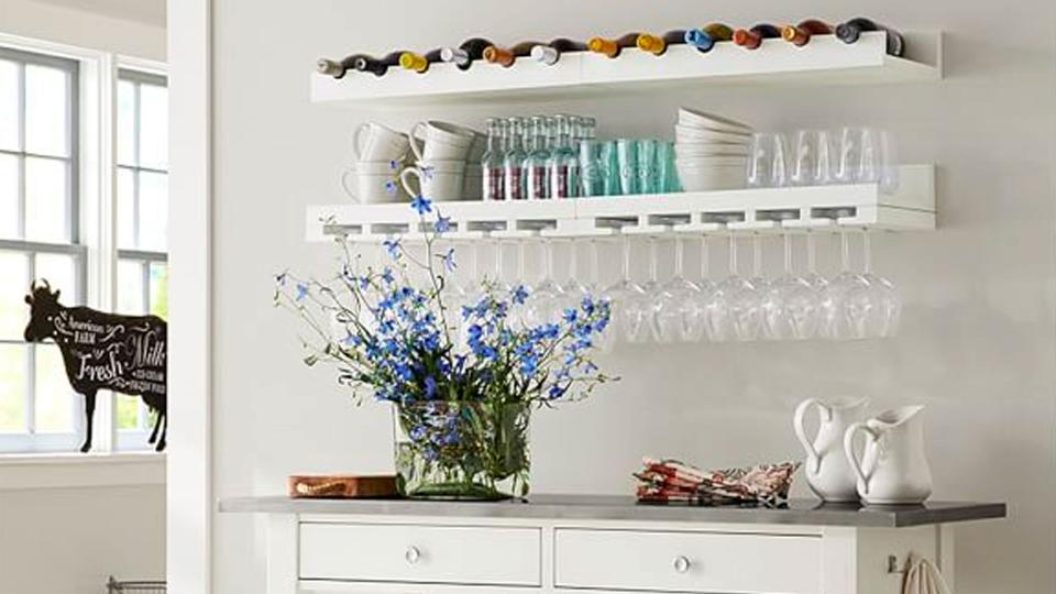 This Pottery Barn floating entertainment shelf is a stylish solution for wine storage.