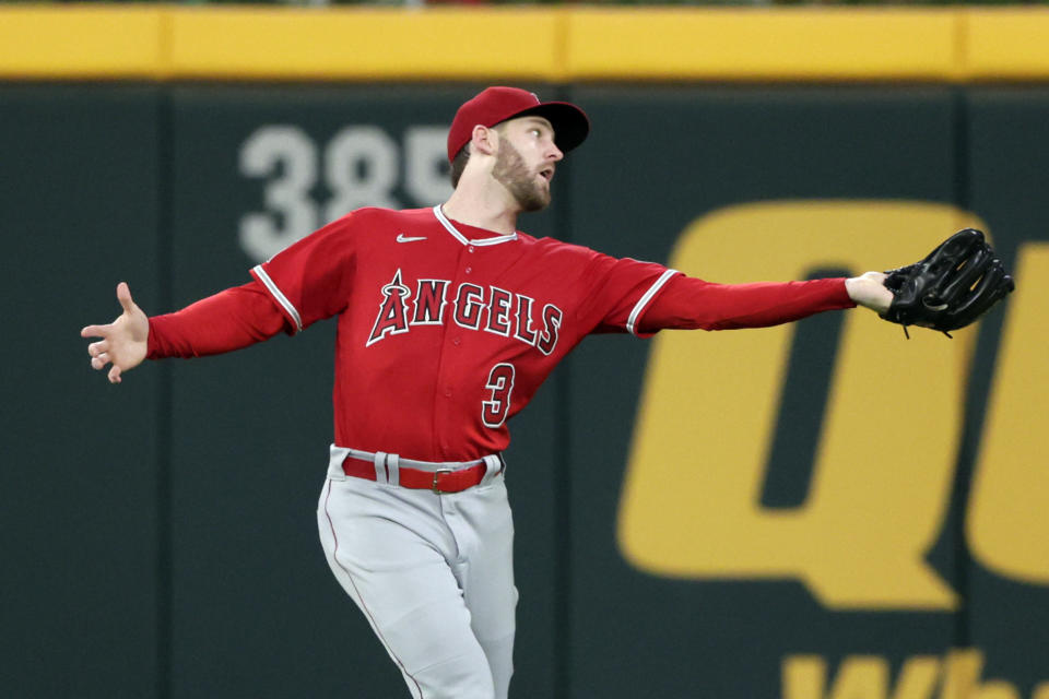 Los Angeles Angels right fielder Taylor Ward catches a fly ball for an out against Atlanta Braves' Travis d'Arnaud during the fifth inning of a baseball game Saturday, July 23, 2022, in Atlanta. (AP Photo/Butch Dill)