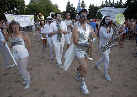 A band warms up cyclists as they prepare to pour into the streets of Portland for the 11th annual World Naked Bike Ride June 7, 2014. REUTERS/Steve Dipaola