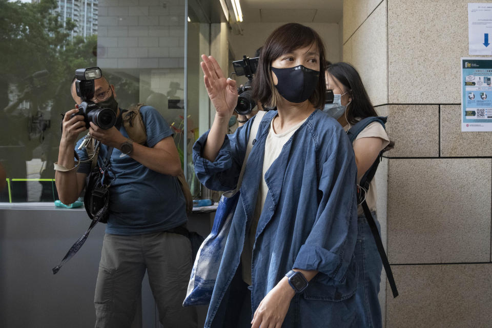 Chan Pui-man, deputy editor of the Apple Daily newspaper, walks out from court in Hong Kong, Saturday, June 19, 2021. A Hong Kong court ordered the top editor of pro-democracy newspaper Apple Daily and the head of its parent company held without bail Saturday in the first hearing since their arrest two days ago under the city's national security law. Chan was one of the five Apple Daily staffs who were arrested by police on Thursday, but she was released on bail Friday. (AP Photo/Kin Cheung)