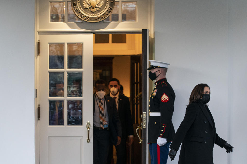 FILE - In this Jan. 22, 2021, file photo Vice President Kamala Harris, right, walks ahead of staff as she leaves the West Wing of the White House in Washington. (AP Photo/Jacquelyn Martin, File)