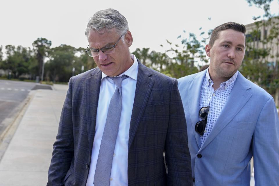 Jake C. Blanchard of Blanchard Law, cries outside court as he laments what became of attorney, Steve Cozzi, after Tomasz Kosowski, a local plastic surgeon, arrested in the death of Cozzi, makes his first appearance in court in Clearwater, Fla., on Monday, March 27, 2023, remotely from the Pinellas County Jail. (Martha Asencio-Rhine/Tampa Bay Times via AP)