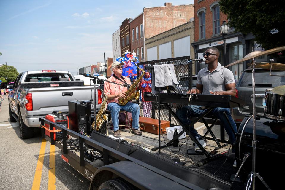 The Soul N the Pocket band, including saxophone player Erick Scales, keyboard player and vocalist Joshua Thomas, and drummer Pal Ziegler, provide the soundtrack to the Street Strut during the 30th W.C. Handy Blues and Barbecue Festival held in Downtown Henderson, Ky., Saturday, June 19, 2021. The band played music on the back of a trailer as they were driven around Downtown Henderson. 