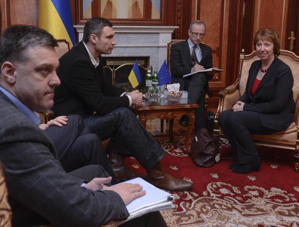 Ukrainian opposition leader Oleg Tjagnibok, left, and Ukrainian lawmaker and chairman of the Ukrainian opposition party Udar (Punch), former WBC heavyweight boxing champion Vitali Klitschko, second left, during their talks with EU foreign policy chief Catherine Ashton, foreground right, during their talks in Kiev, Ukraine, Monday, Feb. 24, 2014. The head of OSCE, the European security organization is proposing the establishment of an international contact group to support Ukraine in its difficult transition period.(AP Photo/Andrew Kravchenko, Pool)