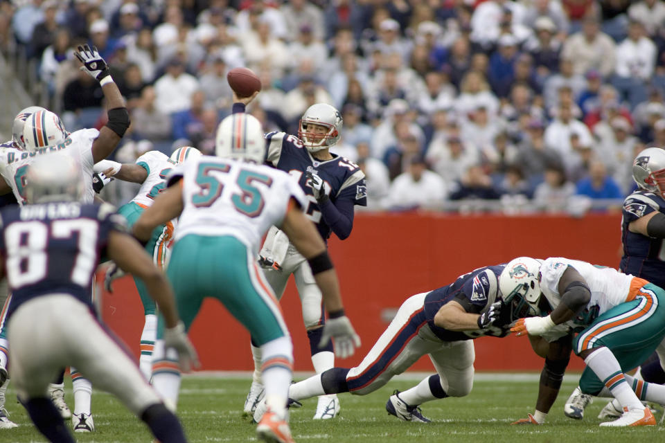 Tom Brady throws a pass in the record-breaking game. (Bernie Nunez/Getty Images)