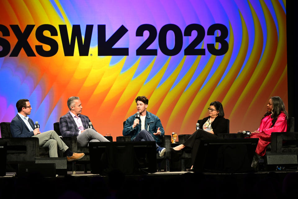 AUSTIN, TEXAS - MARCH 13: (L-R) Thomas Grace, Jake Leach, Nick Jonas, Mireya Martinez and Leslie Herod speak onstage at 