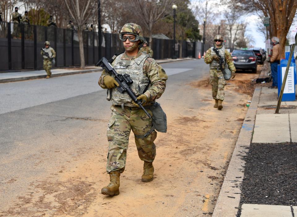 Members of the National Guard patrol around the U.S. Capitol on Jan. 18.