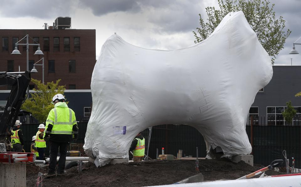 A 10-by-14-foot replica of the Scottie dog token from Monopoly will be part of the new Hasbro Game Park at The Strong National Museum of Play. Still covered in shrink wrap, he has a metallic finish and looks just like the real game piece.